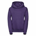 A Russell J575B hooded sweatshirt in purple, featuring a front pocket, is displayed on a plain white background. The hoodie showcases a simple and unadorned style, complete with long sleeves and a relaxed fit.