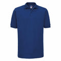 A plain, dark blue Russell J599M polo shirt with short sleeves and a collar, displayed against a white background. The shirt showcases a straightforward design with no visible logos or patterns.