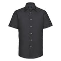 Russell Collection's J923M, a black short-sleeve button-up shirt with white buttons, is displayed against a plain background.