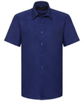 A plain short-sleeve button-up shirt in navy blue from the Russell Collection, model J923M.