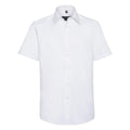 Product: Russell Collection's J923M - A short-sleeved, white dress shirt featuring a button-up front and a classic collar, showcased against a plain white background.