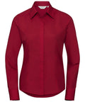 A J924F shirt from the Russell Collection, featuring red long sleeves, a button-up design, and a classic collar. The shirt is showcased against a white background, highlighting its tailored fit and clean lines.
