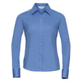 The J924F from Russell Collection is a fitted corporate blue long-sleeve collared shirt featuring a button closure, showcased against a plain white background.