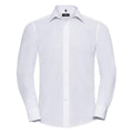 The Russell Collection's J924M is exhibited against a simple background, showcasing its classic white design. The shirt features long sleeves, a pointed collar, and a button-down front. Its tailored fit and buttoned cuffs lend it a formal and crisp appearance.