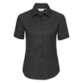 The Russell Collection's J933F is a black short-sleeve button-up shirt featuring a classic collar, showcased against a white background.