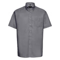 The J933M by Russell Collection, a gray short-sleeved, button-up shirt featuring a front pocket, is showcased against a white background.
