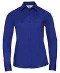 The J934F from Russell Collection is a royal blue, long-sleeved shirt featuring a button-up design with a collar and a left chest pocket.