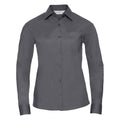 The Russell Collection J934F is a gray dress shirt featuring long sleeves, a button-up front, and a pocket on the left chest. Displayed against a white background, it showcases its classic collar and tailored fit.