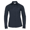 A long-sleeved, button-up shirt by Russell Collection, featuring a classic collar and chest pocket in dark navy blue, is displayed against a plain white background. The product name for this shirt is J934F.