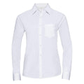 A long-sleeved white dress shirt from the Russell Collection, product J934F, featuring a front pocket and a button-up design. The shirt showcases a classic collar and is displayed against a plain white background.