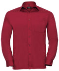 The J934M by Russell Collection is a red, long-sleeved button-up shirt featuring a pointed collar and a chest pocket on the left side, showcased against a white background.