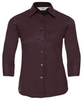 A maroon Russell Collection shirt, identified as product J946F, featuring a button-up front, three-quarter sleeves, and a pointed collar.