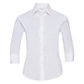 A neatly pressed J946F, a white, long-sleeved button-up shirt from the Russell Collection, featuring a classic collar. The shirt is elegantly displayed on an invisible mannequin against a plain background.
