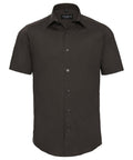 The product J947M by Russell Collection is a dark brown, short-sleeved button-up shirt with a collar, displayed in a front view.
