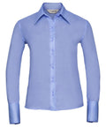 Product J956F, a light blue button-up shirt with long sleeves and a pointed collar from the Russell Collection, is displayed on a white background.