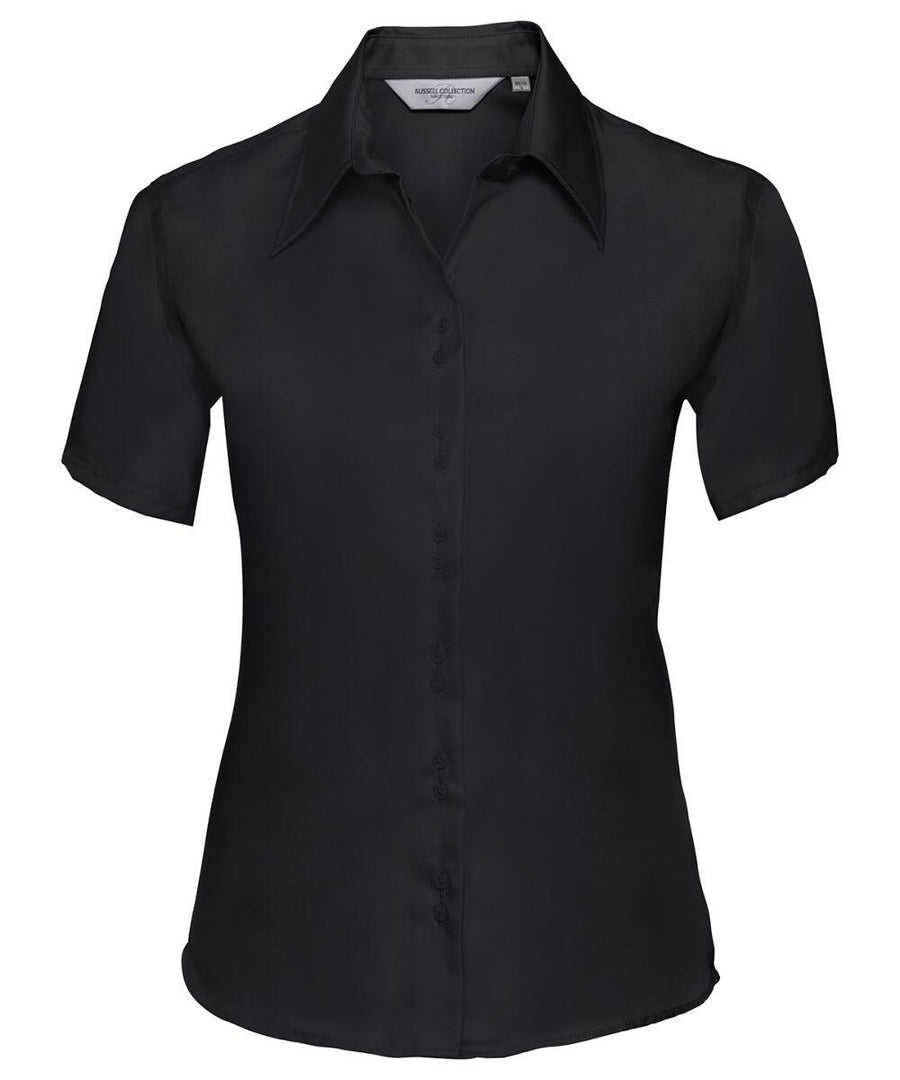 Russell Collection's J957F, a short-sleeved black shirt with a collar, is shown against a plain white background.