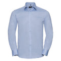 The J962M from Russell Collection is a light blue dress shirt featuring long sleeves, a button-up front, and a pointed collar.