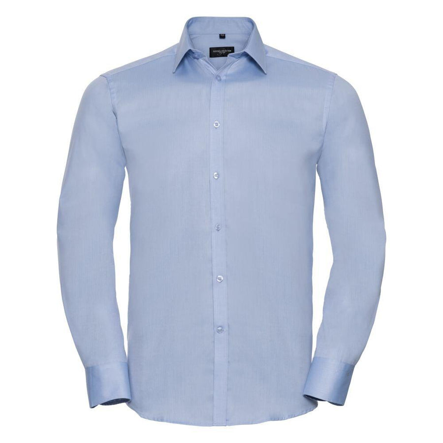 The J962M from Russell Collection is a light blue dress shirt featuring long sleeves, a button-up front, and a pointed collar.