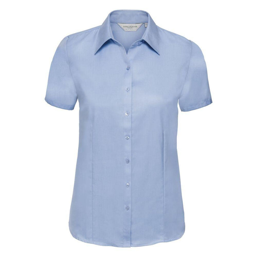 A J963F shirt from Russell Collection in light blue featuring short sleeves, a collar, and button-down front.