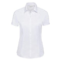 A short-sleeved, white button-up shirt from the Russell Collection, featuring a collar and set against a plain background. Product Name: J963F.