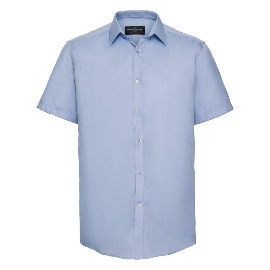 J963M short-sleeve button-up shirt in a light blue color from the Russell Collection, displayed on a white background.