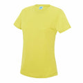 The JC005 by AWDis Just Cool is showcased on a white background. This plain yellow short-sleeve t-shirt features a round neckline and seems to be crafted from a soft, lightweight fabric. A small tag can be seen at the back of the neck area.