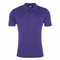 The JC021 by AWDis Just Cool is a plain purple polo shirt featuring short sleeves, a collar, and three buttons at the neckline, shown against a white background.