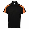 The JC043 by AWDis Just Cool is a black polo shirt featuring orange stripes on the shoulders and sleeves, showcased against a white background.
