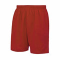 The image showcases the JC080 pair of red athletic shorts by AWDis Just Cool, featuring an elastic waistband and set against a plain white background.