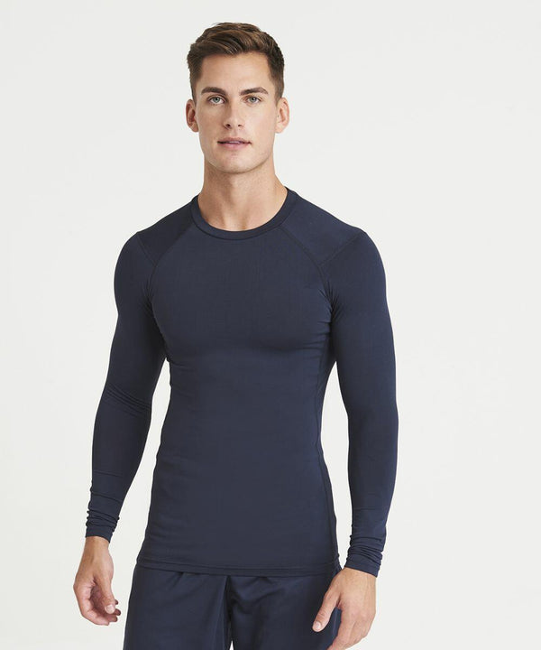 A man wearing a form-fitting navy blue JC232 from AWDis Just Cool stands against a plain white background.