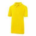 The JC40J by AWDis Just Cool is a vibrant yellow polo shirt with short sleeves and a collar. It includes a three-button placket and is showcased against a plain white background.