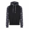 The JH009 hoodie by AWDis Just Hoods is black and features camouflage-patterned sleeves and hood, along with a front pocket and drawstrings.