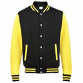 Introducing the AWDis Just Hoods JH043: a stunning varsity jacket in black with vibrant yellow sleeves and accents. It is designed with white buttons and features ribbed cuffs, collar, and hem adorned with striking yellow stripes. The jacket also includes two conveniently placed pockets trimmed in yellow for added style.