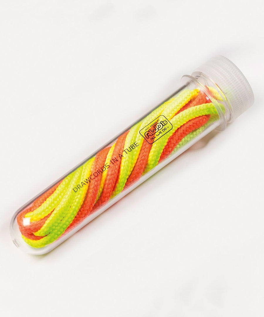 A clear plastic tube featuring yellow, green, and orange drawcords from the AWDis Just Hoods JH200 collection.