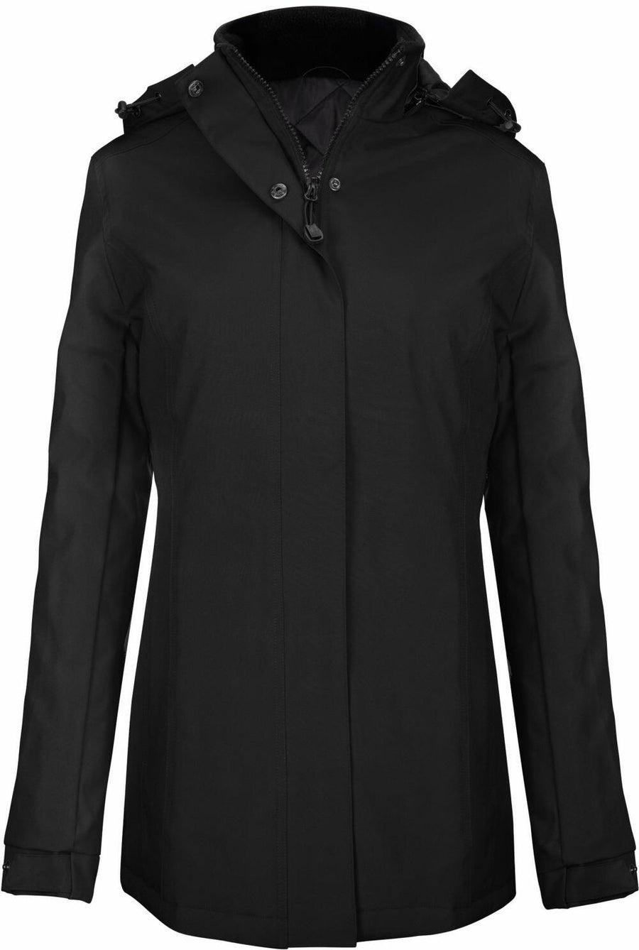 A black Kariban winter coat, model K6108, featuring a hood, front zipper, and button closures.