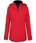 A red hooded jacket with black interior lining, displayed on a white background. The K6108 by Kariban has a zipper and buttons on the front.