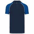 Introducing the Kariban KB226, a stylish polo shirt in navy blue featuring royal blue sleeves and collar. This shirt is designed with a button-up front and contrasting piping along the sleeve seams for a modern touch.