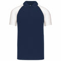 Introducing the KB226 by Kariban: This short-sleeved polo shirt boasts a navy blue body paired with stylish white raglan sleeves, complete with a classic collar and three-button detail.