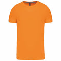 The Kariban KB356 short-sleeve t-shirt in orange, featuring a round neckline, is displayed against a white background.