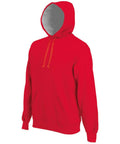 Introducing the KB443 by Kariban: A vibrant red hooded sweatshirt featuring a front pouch pocket and adjustable drawstrings. This hoodie boasts a contrasting gray interior lining in the hood and ribbed cuffs at the wrists for added comfort and style.