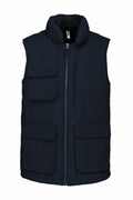 The Kariban KB615 is a sleeveless black puffer vest featuring a front zipper and multiple pockets.