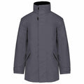 The KB677 by Kariban is a gray winter jacket that includes a high collar and adjustable cuffs, along with a concealed zipper and snap button closure.