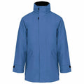 The Kariban KB677 is a blue winter jacket featuring a high collar and full sleeves. It includes a front zipper concealed by a flap, Velcro adjustable cuffs, and two diagonal pockets on the front.