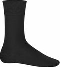 A solitary black Kariban KB813 sock displayed against a simple white backdrop.