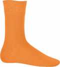 A single mid-calf length orange sock with a plain design from Kariban's KB813 line, displayed against a white background.