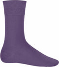A lone Kariban KB813 sock in purple is showcased upright against a simple white background.