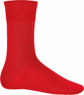 The Kariban KB813 is a single bright red sock featuring a smooth texture and mid-calf length, showcased on a plain white background.