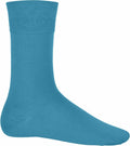 Displayed against a white background is a single side-profile view of the bright blue Kariban sock, model KB813. It features a smooth texture and extends to mid-calf length.