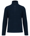 A Kariban KB912 navy blue long-sleeve fleece pullover with a quarter-zip front and a high collar.