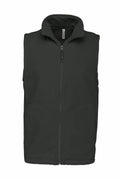 The Kariban KB913 is a sleeveless fleece vest in dark green, featuring a front zipper and two side pockets.
